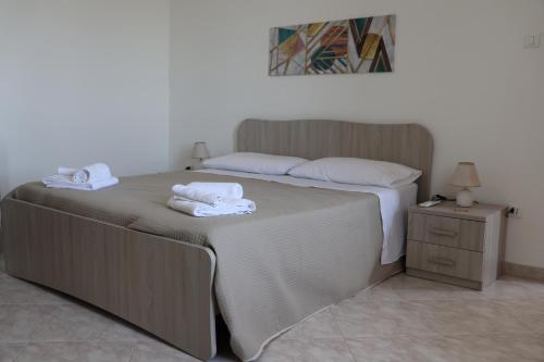 a bedroom with a bed with towels on it at Al Giardino b&b in Acri