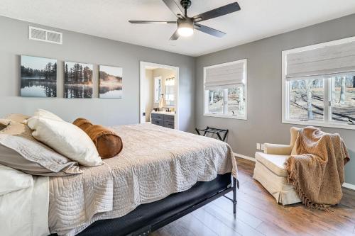 a bedroom with a bed and a ceiling fan at Waterfront Deck, Shell Knob Gem on Table Rock! in Shell Knob