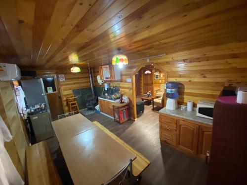 an overhead view of a kitchen in a log cabin at Chiloe Seta in Ancud