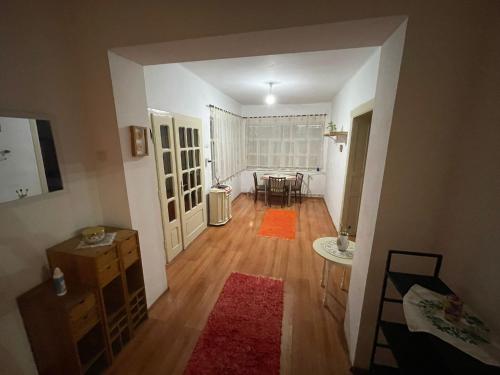 an empty living room with a table and a dining room at Casa Dalia 1 in Sighişoara