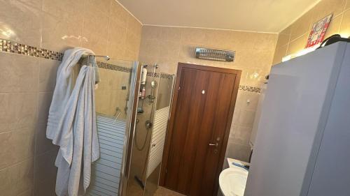 a bathroom with a shower and a toilet and a sink at Boutique in Rothschild in Rishon LeẔiyyon