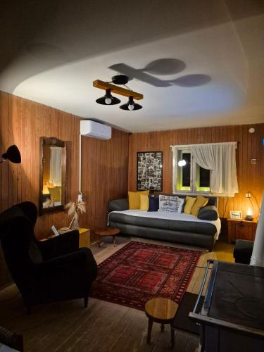 a living room with a couch and a table at Simina kuća in Bajina Bašta