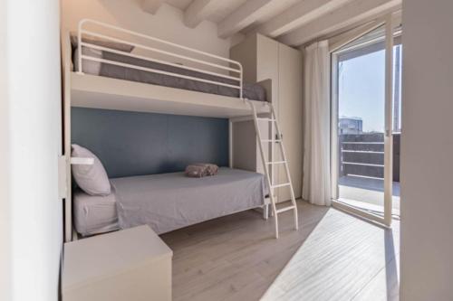 a bedroom with a bunk bed and a ladder at Apartment-Boutique Gioia in Cittadella
