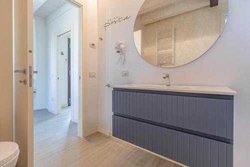 a bathroom with a sink and a mirror at Apartment-Boutique Gioia in Cittadella