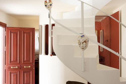a staircase in a home with white stairs at Corfu Olive Village with Swimming Pool Castello Di Vista in Análipsis
