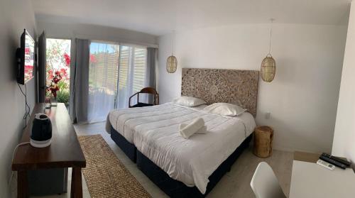 Llit o llits en una habitació de Brisas de Centenario
