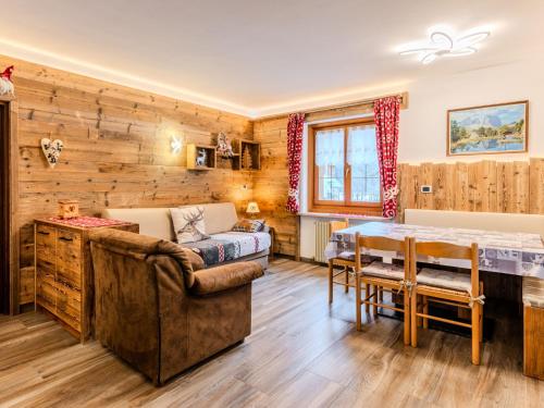 a living room with a couch and a table at Apartment Cristina by Interhome in Campestrin