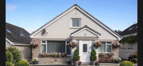 a house with flowers in front of it at Crayford's Guest House in Aberdeen