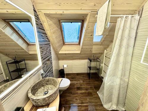 a bathroom with a sink and a toilet in a house at Sykowno chata in Szczyrk
