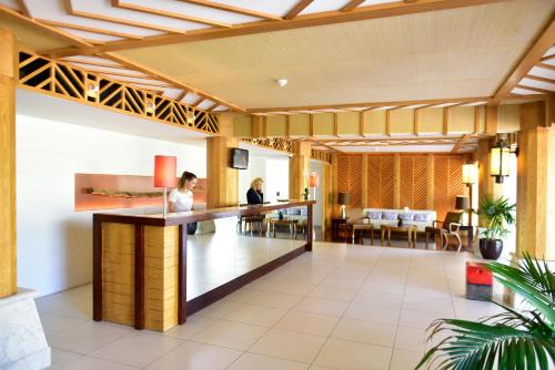 a lobby with a bar and a dining area at Pestana Porto Santo Beach Resort & SPA in Porto Santo