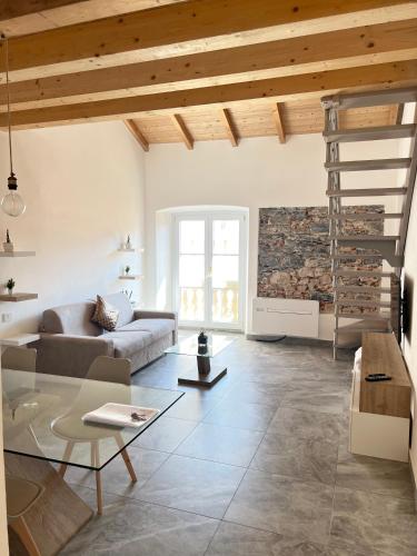 a living room with a couch and a table at R&V Apartments - Nel cuore di La Spezia in La Spezia