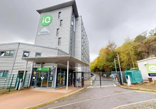 a building with a sign on the side of it at iQ Parker House Dundee in Dundee