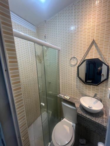a bathroom with a shower and a toilet and a sink at flat Luiz Carlos Mouzinho in Teresina