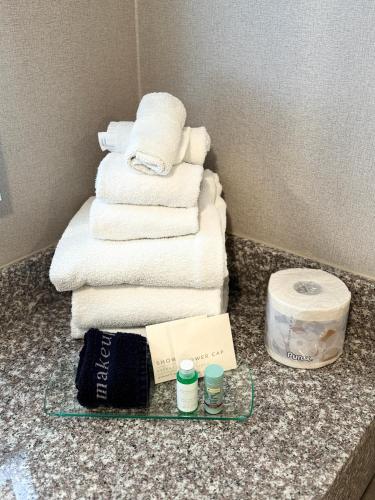 a pile of towels on a counter in a hotel room at Best Western Mountainview Inn in Golden