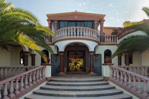 a house with a staircase leading to the front door at La Valise Los Cabos, Member of Small Luxury Hotels in Boca de la Vinorama