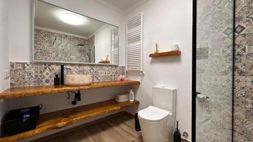 a bathroom with a sink and a toilet at Casa Amis Calpe in Calpe