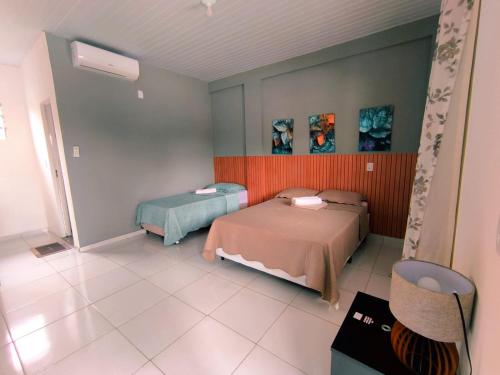 a bedroom with two beds in a room at Asas da Maré Pousada in Bragança