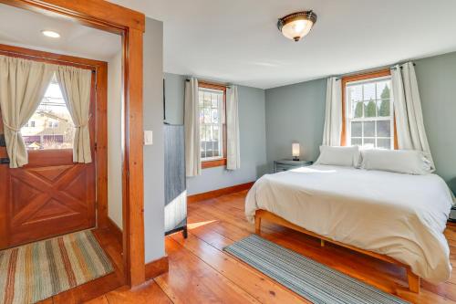 a bedroom with a bed and a wooden door at Walk to Memorial Park: Pet-Friendly Bethlehem Home in Bethlehem