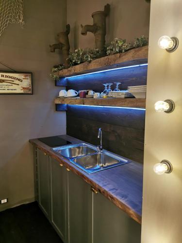 a kitchen with a sink and a counter at sweet home in Biella