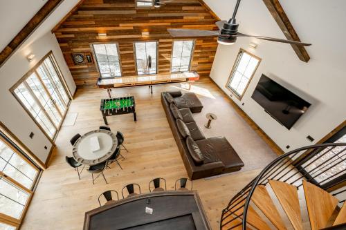 an overhead view of a living room with a couch and a table at Deep Creek Modern by Railey Vacations in Oakland