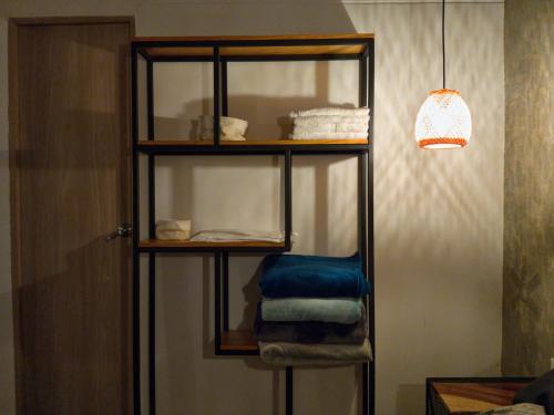 a shelf with folded towels in a room at Green mount in Medellín