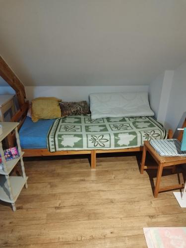 a bedroom with a bed in a room at En coloc' chez Charlotte in Dunkerque