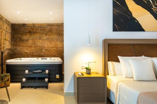 a bedroom with a bed and a bath tub at AC Encanto in La Cisnera