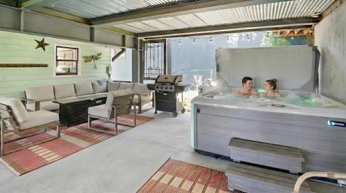 a couple in a hot tub in a room at Summit Home Multi-level with PC Views Ski Trail in Park City
