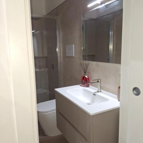 a bathroom with a sink and a toilet at Casa Bruno in Palermo