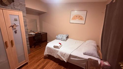 a small bedroom with a bed and a sink at Cozy House Nested Around Trees E in San Jose