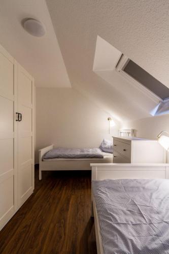 a bedroom with two beds in a attic at Ferienwohnung-Mour in Dahme