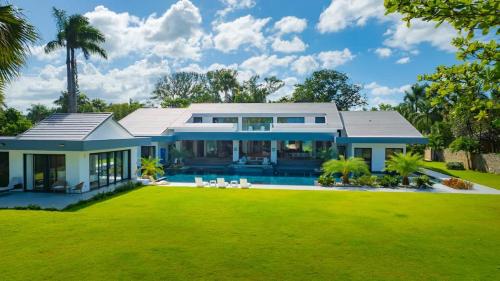 a large house with a large yard at Luxury villa with Private beach access in Sosúa