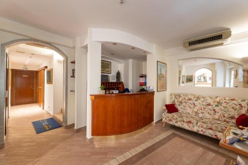 a living room with a couch and a hallway at Villa Fontana in Trogir