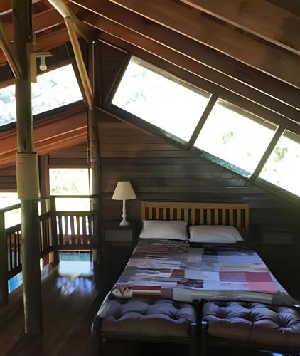 Postel nebo postele na pokoji v ubytování Refúgio Alpino - Hidro, Lareira e Vista pra Serra