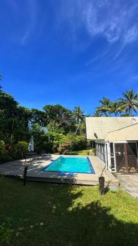 a swimming pool in the yard of a house at Villa Serenity welcomes you in Pacific Harbour