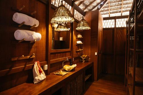 a bathroom with a sink and a mirror at Vila Guará in Atins