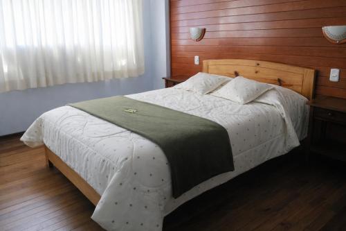 Llit o llits en una habitació de Hostal Arias