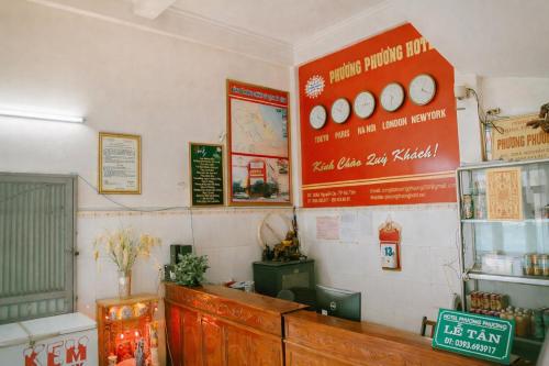 a fast food restaurant with a sign on the wall at Phương Phương 1 Hotel in Hà Tĩnh