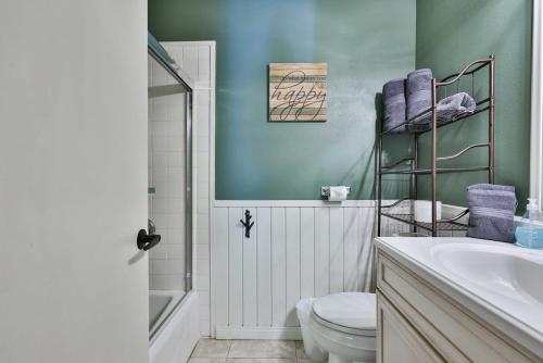 a bathroom with a white toilet and a sink at Spa Steps to Lift Private Spa BBQ Massage Chair in Big Bear Lake