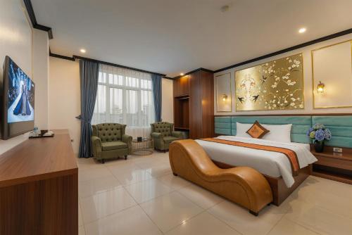 a bedroom with a large bed in a room at Royal Hotel & Spa in Ðồng Ky