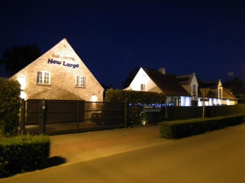 a building with a new lease sign on it at night at Holiday Home New Largo in Nieuwpoort