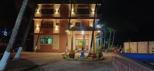 a house with a fire hydrant in front of it at SAHAY VILLA RESORT in Durbate