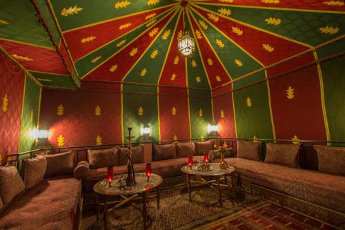a room with a couch and a circus tent at Riad Jardin Chrifa in Fès