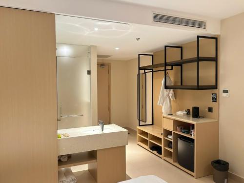 a bathroom with a sink and a shower at Arena Oceanview Cam Ranh - Infinity swimming pool in Cam Ranh International Airport