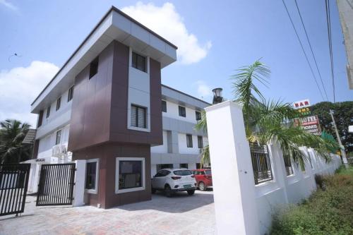 a view of the front of a building at Veliyil Towers in Alleppey
