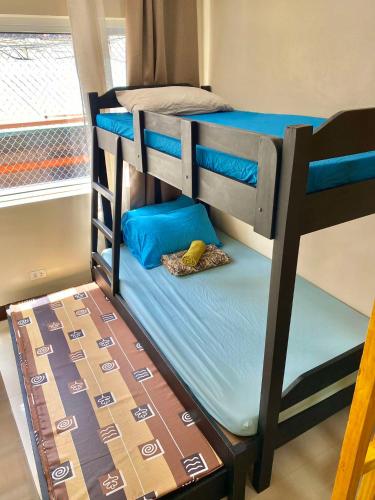a couple of bunk beds in a room at LG-15B City Center Staycation at Megatower 1 in Baguio