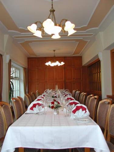 a long table in a conference room with chairs at Gasthaus-Pension Zum Kreuz in Stühlingen