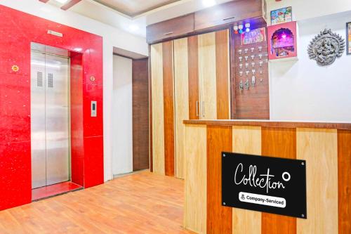 a lobby with a red door and a red elevator at Collection O Taragarh Fort in Ajmer