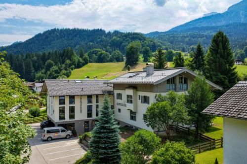 an aerial view of a building with a parking lot at Alpenglühn Apartments - Adult Only in Berchtesgaden
