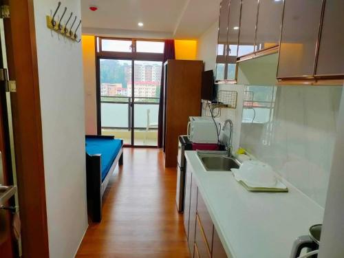 a kitchen with a sink and a counter top at 8F-08 Overlooking Condo at Megatower 3 in Baguio